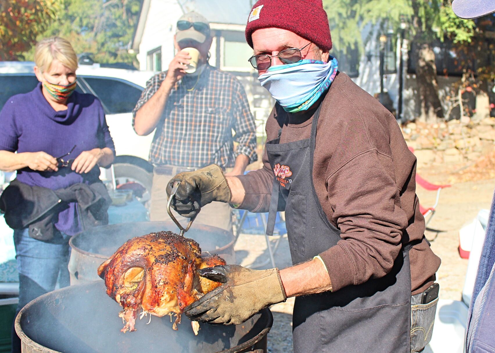 2. Willie The Hooker removes a turkey from one of the many barrels. photo by Dave Gebauer..jpg